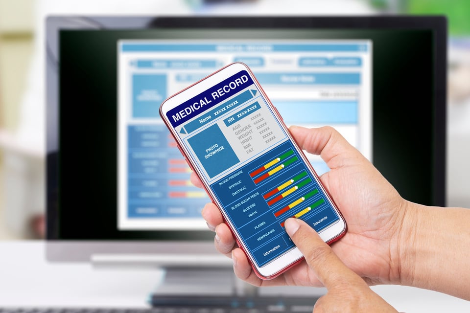 Electronic medical records displayed on different electronic devices.